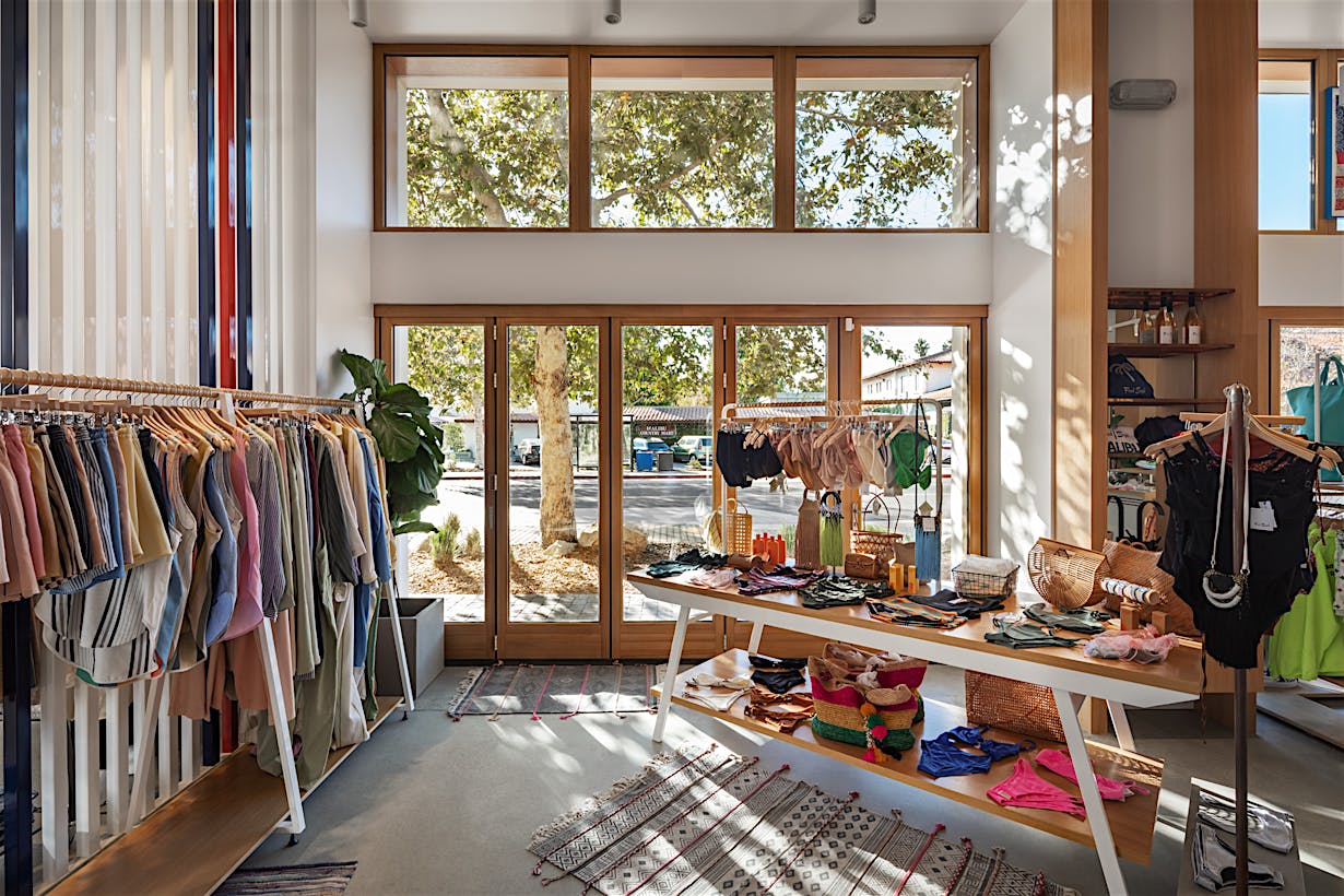 Retail storefront with wood framed folding glass wall