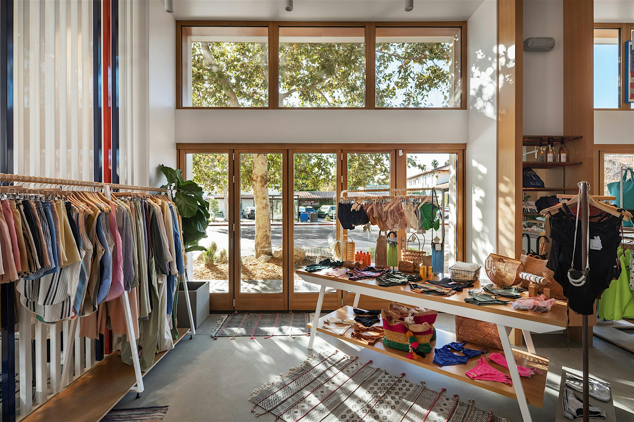 Retail storefront with wood framed folding glass wall