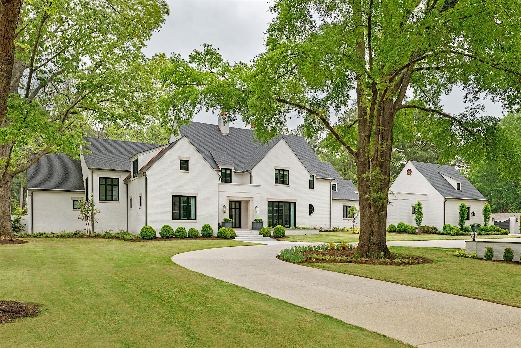 White house with a driveway - NW Aluminum 840 residential glass walls