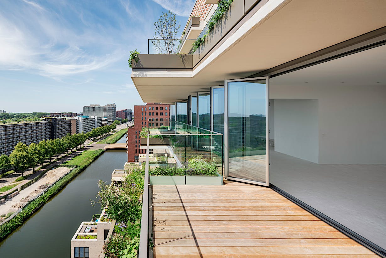 Folding deck doors with a view of a city and a river