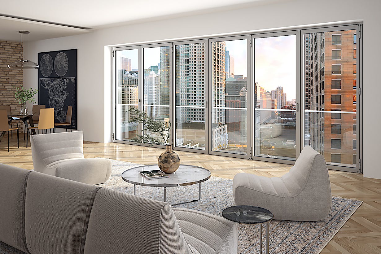 A living room with large windows overlooking a city