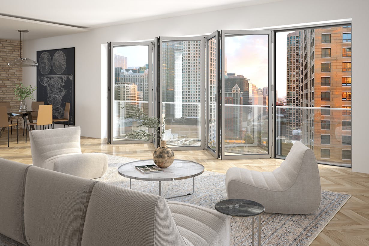A living room with Folding Glass Walls framing a stunning view of the city