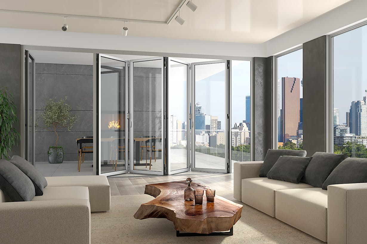 Multifamily living room glass walls with view of the city skyline