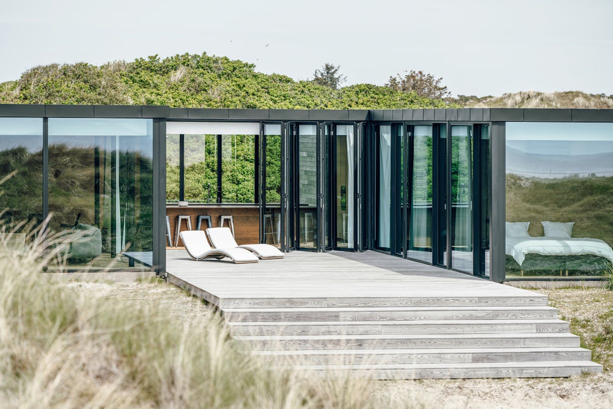 Beach Front House with Folding Glass Walls 