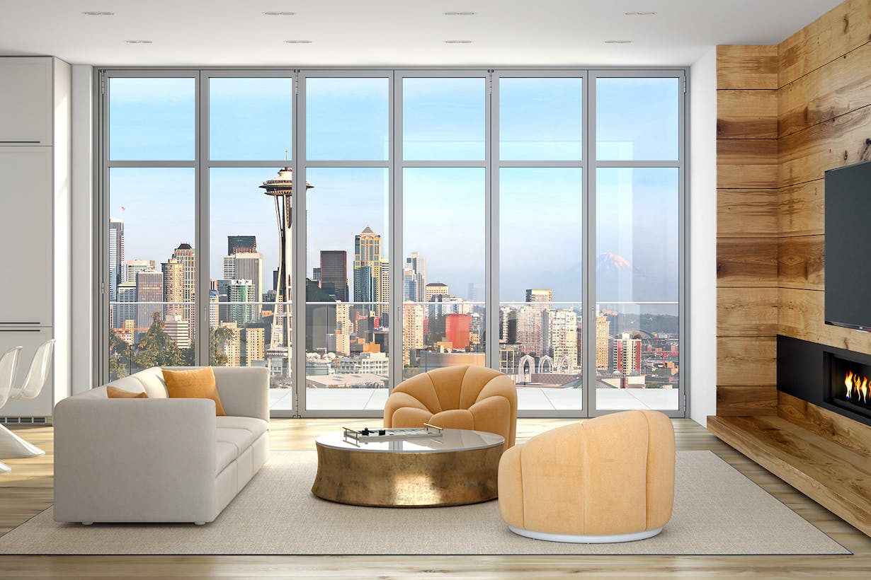 A high rise living room with glass walls, offering an incredible view of the city and featuring a cozy fireplace