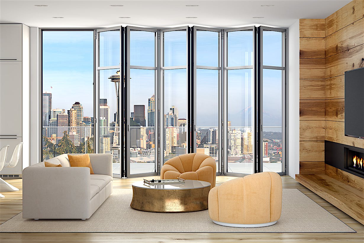 A living room with large windows overlooking a city