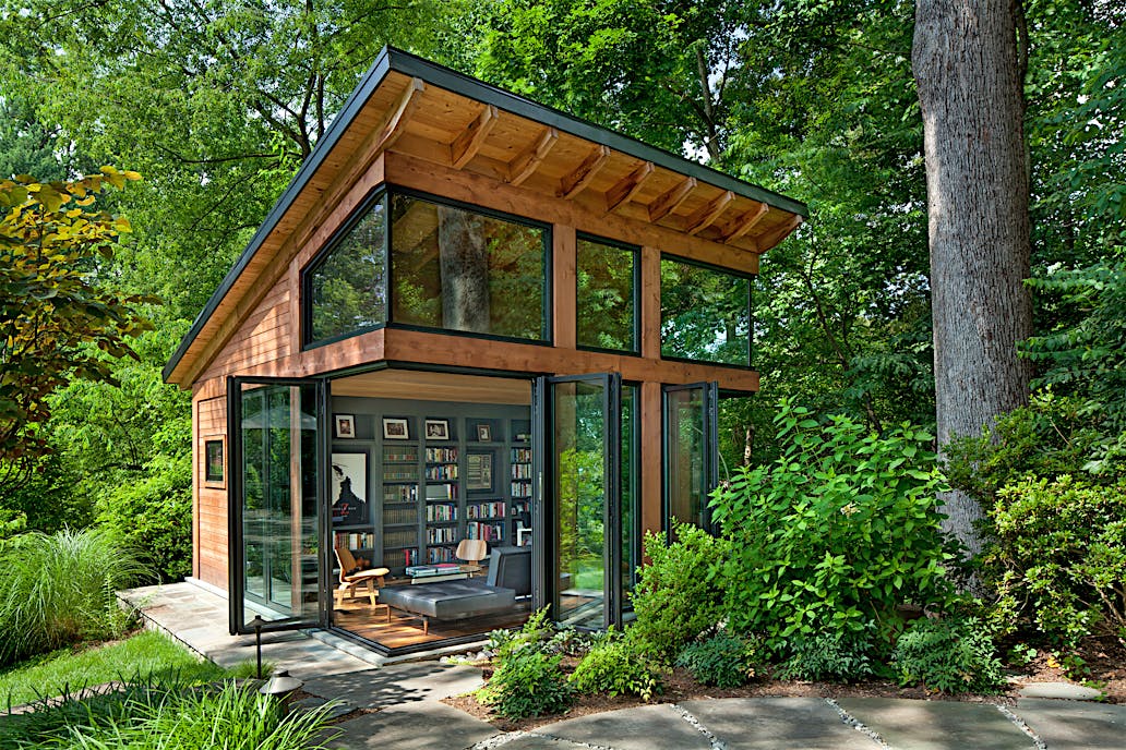 Open-corner accordion glass patio doors in Arlington, VA ADU expand living space into the garden, creating seamless indoor-outdoor flow