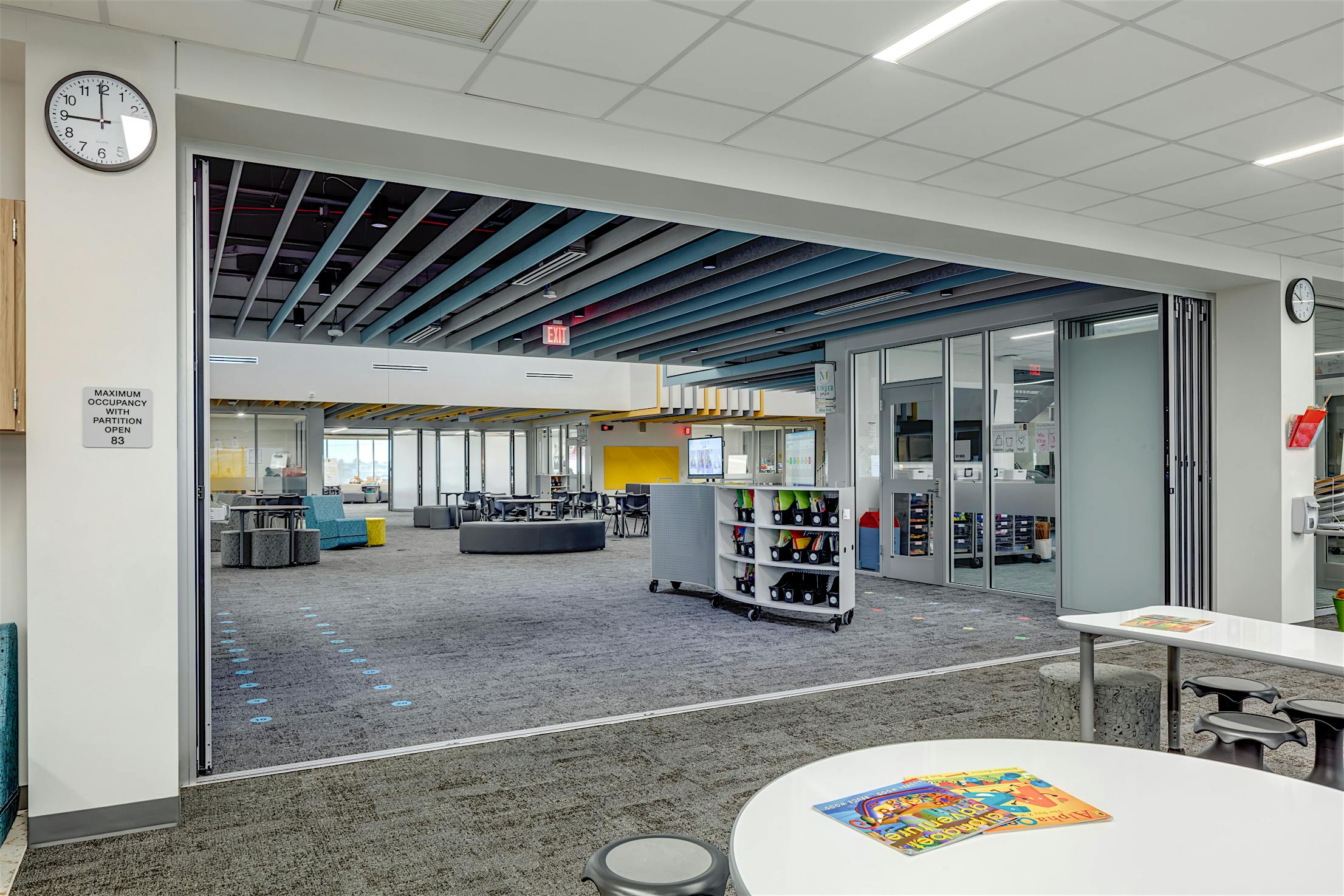 Acoustical movable glass walls- opened panels exterior