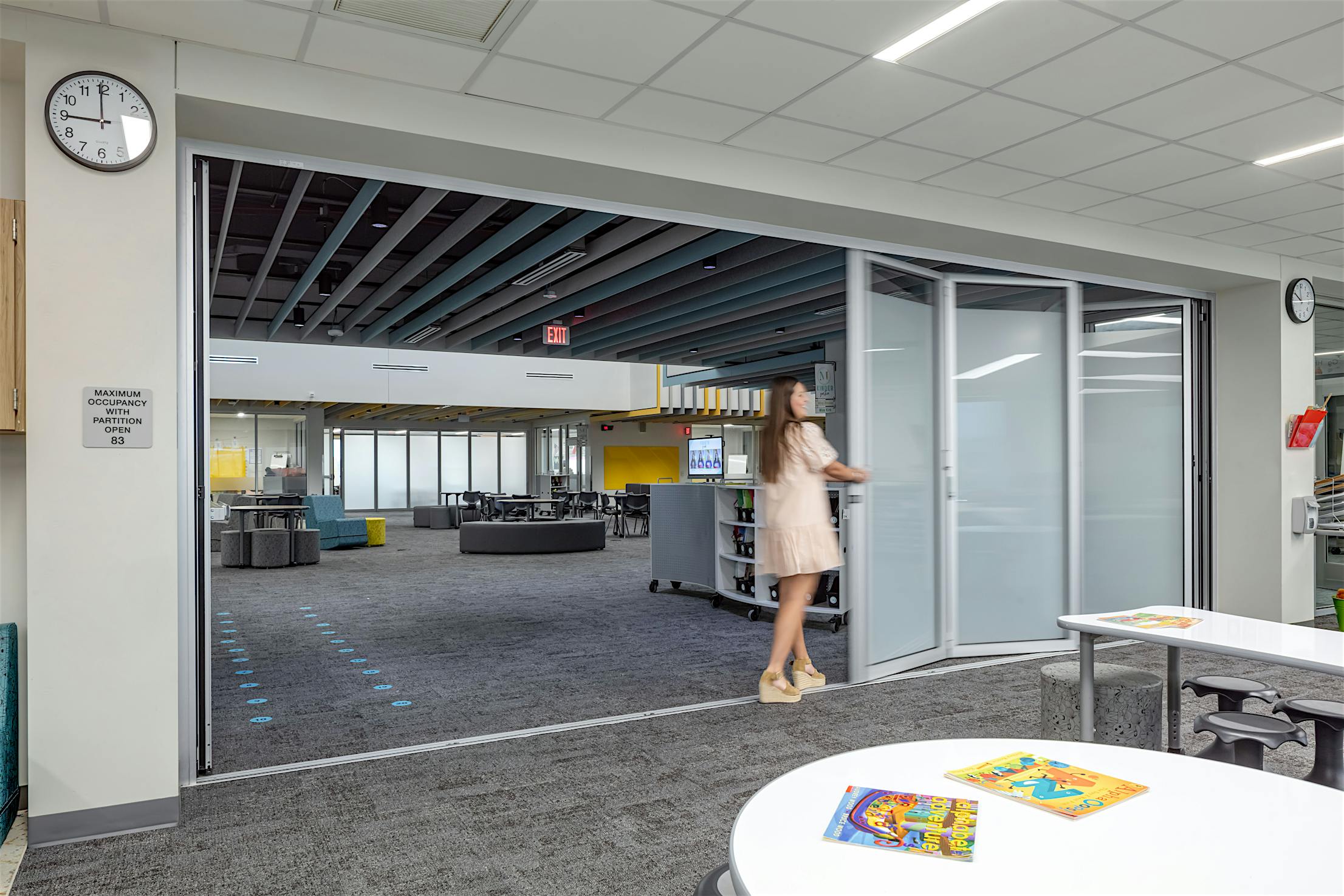 Acoustical movable glass walls- partially opened panels exterior