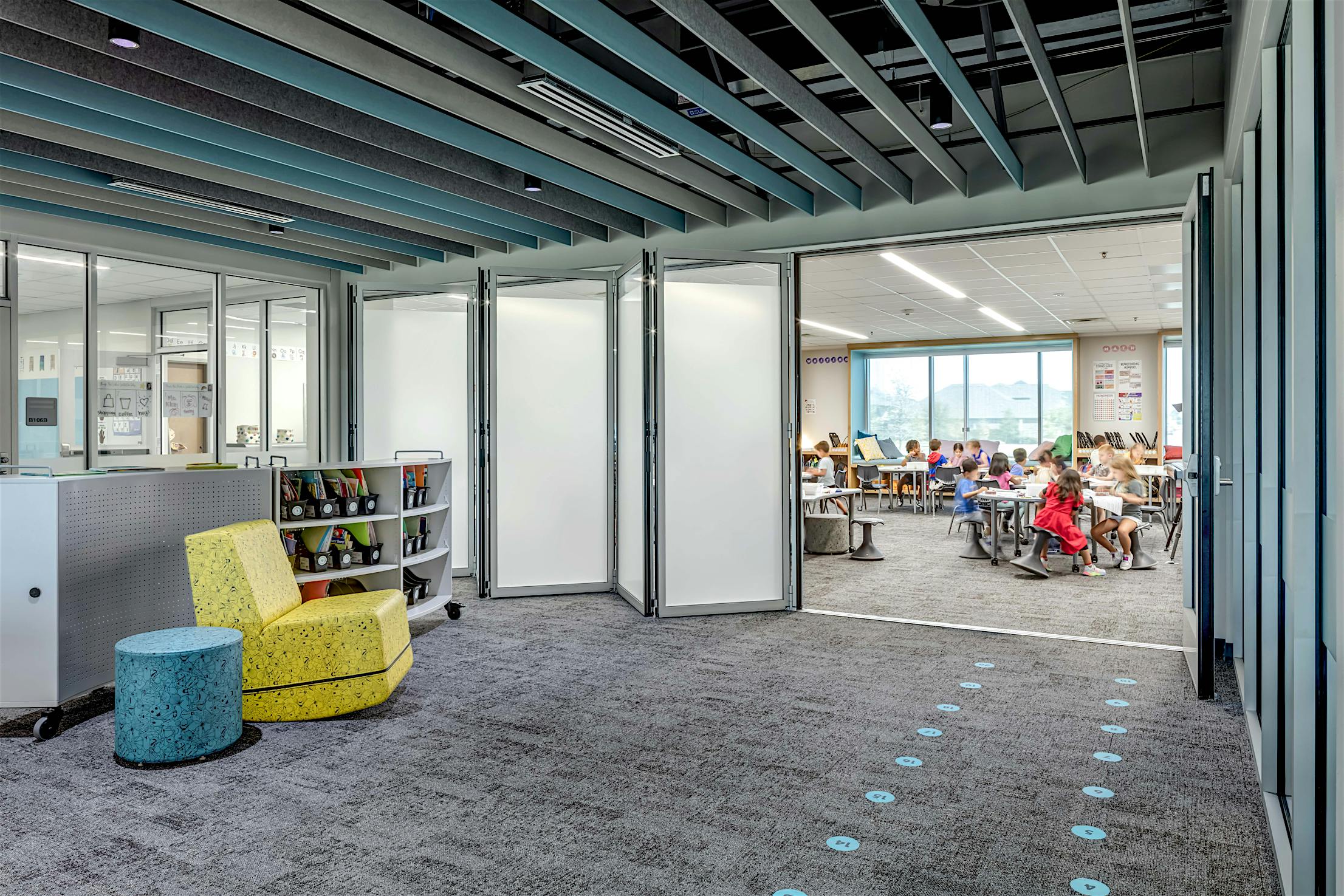 A classroom with acoustical folding glass walls