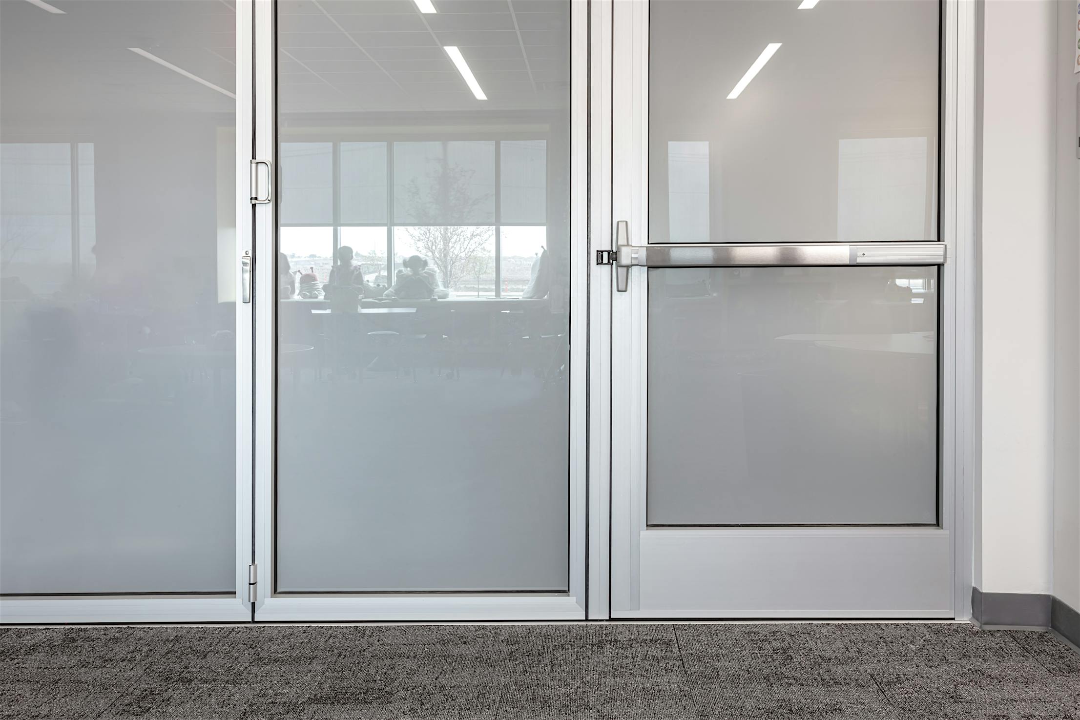 Acoustical movable glass walls at Minett Elementary- ADA Panic Hardware