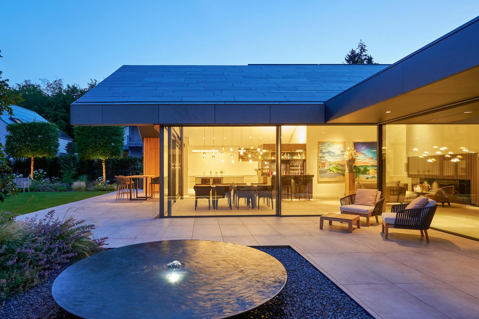  A modern house with a water feature - sliding doors