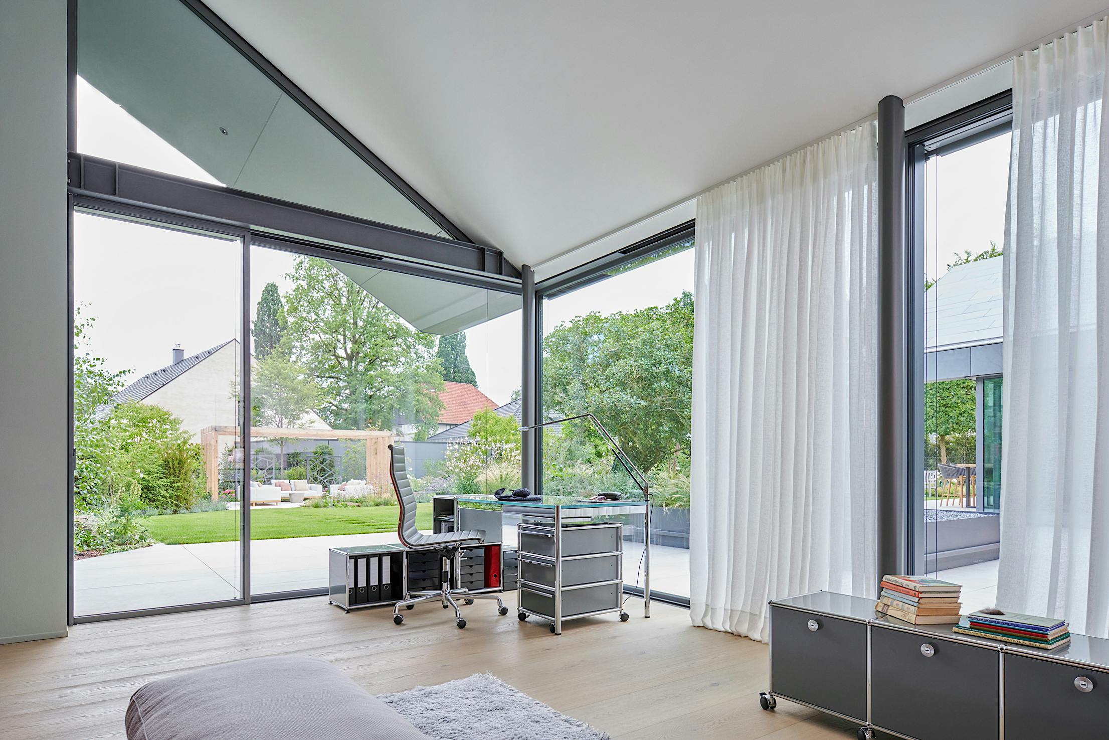 Living room interior with minimal glass walls