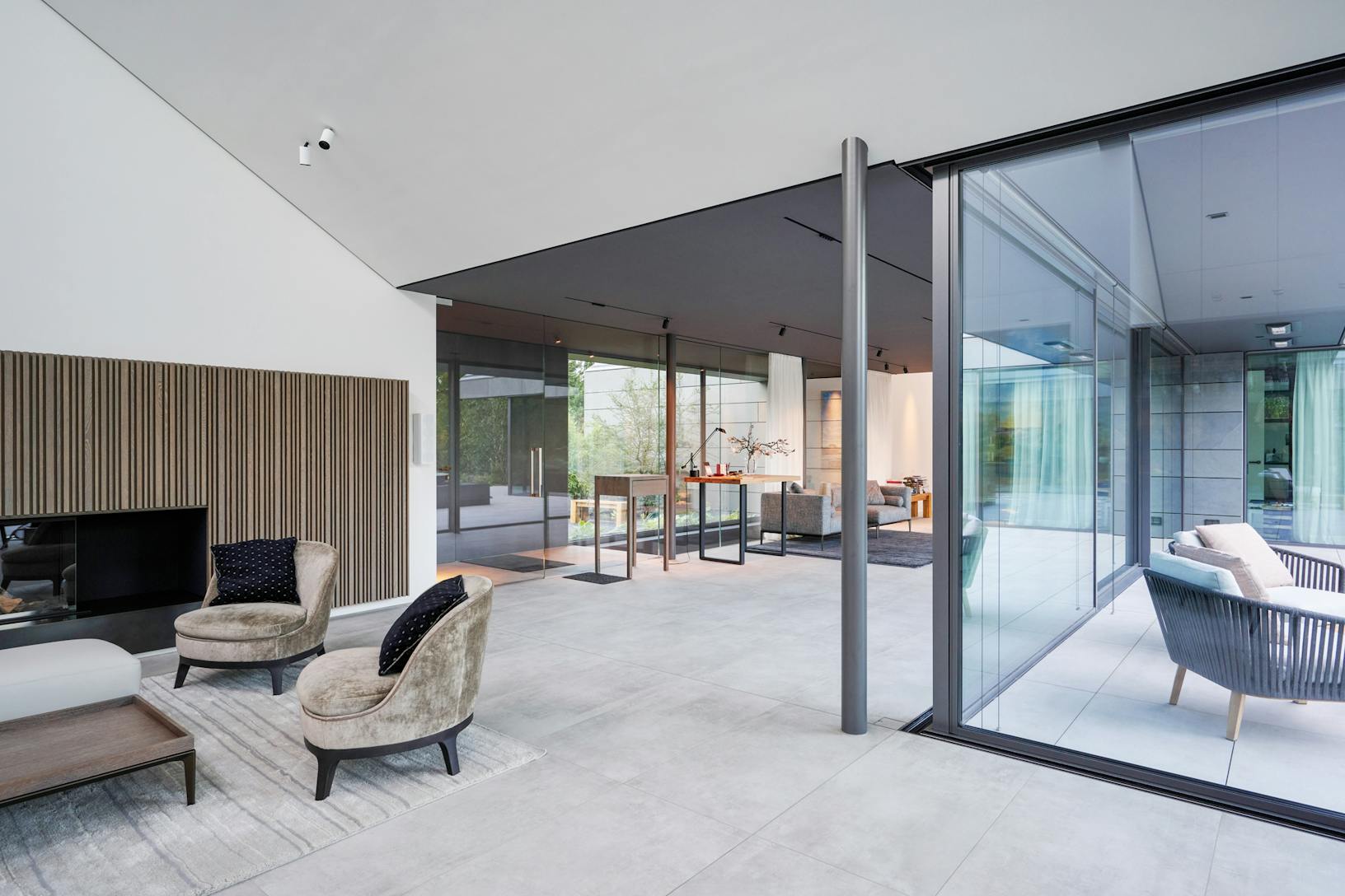 A modern living room with glass sliding doors