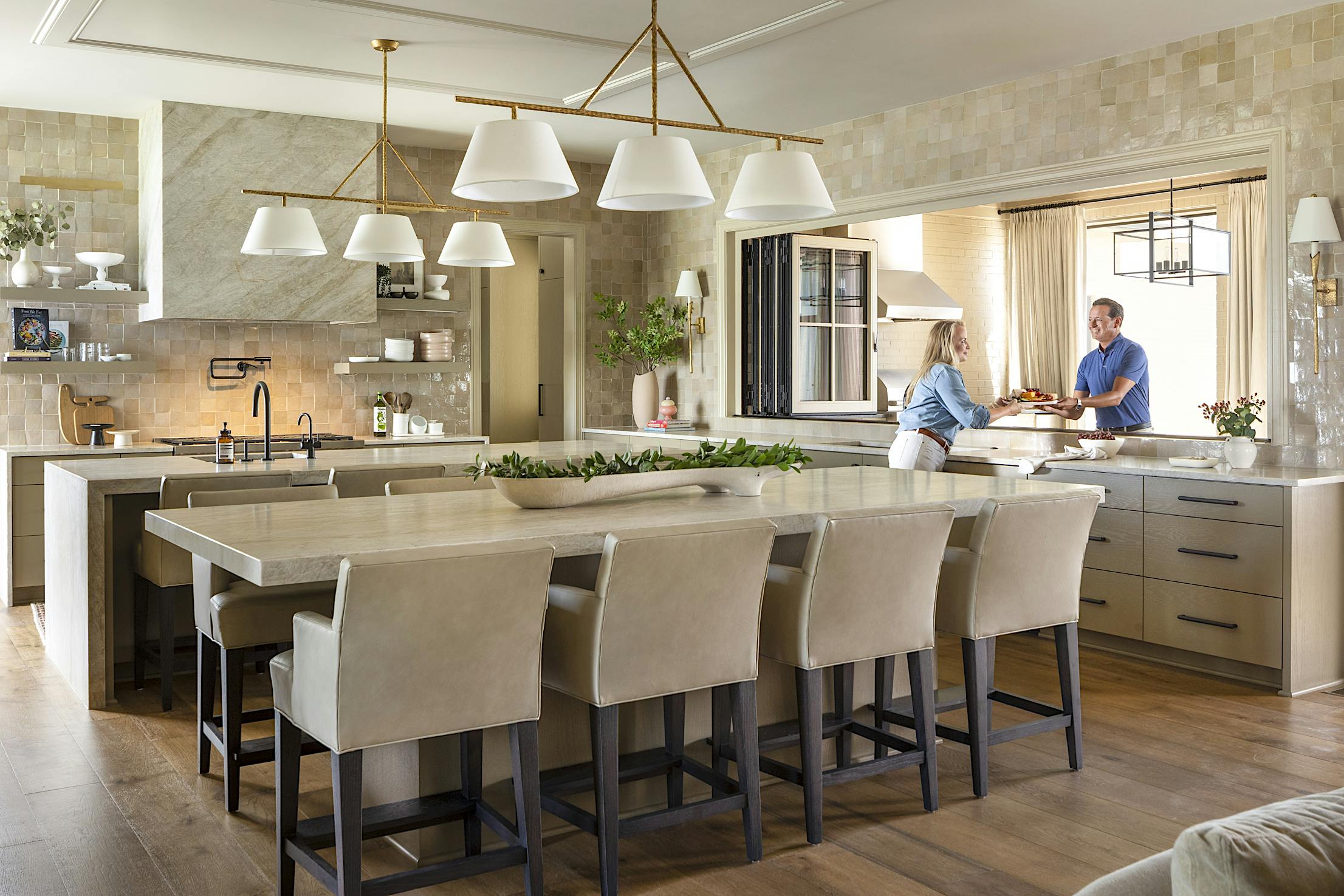 A kitchen with a center island and folding windows