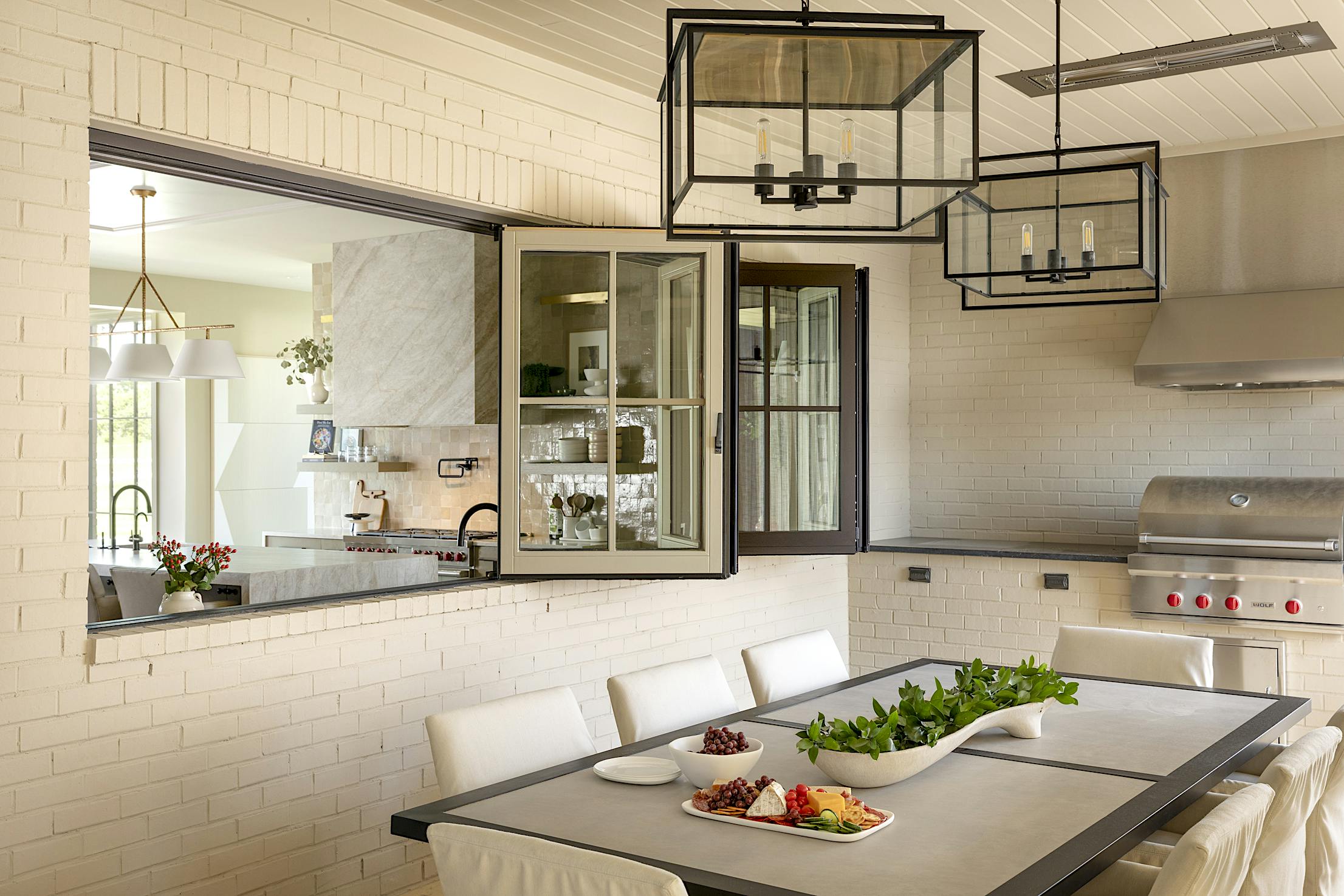 A kitchen with folding windows