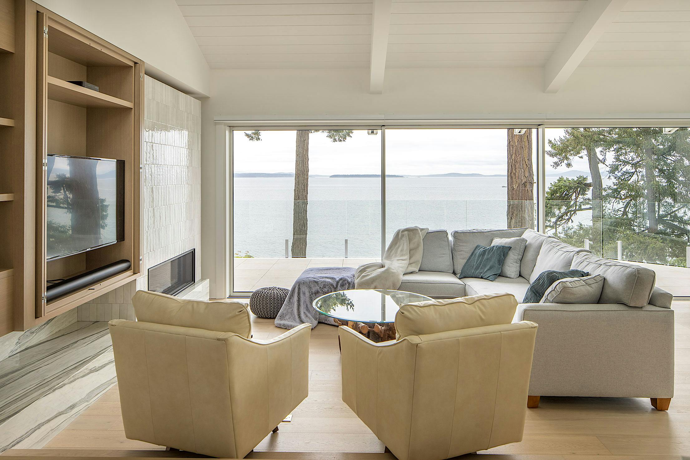 Modern living room with large opening sliding glass walls