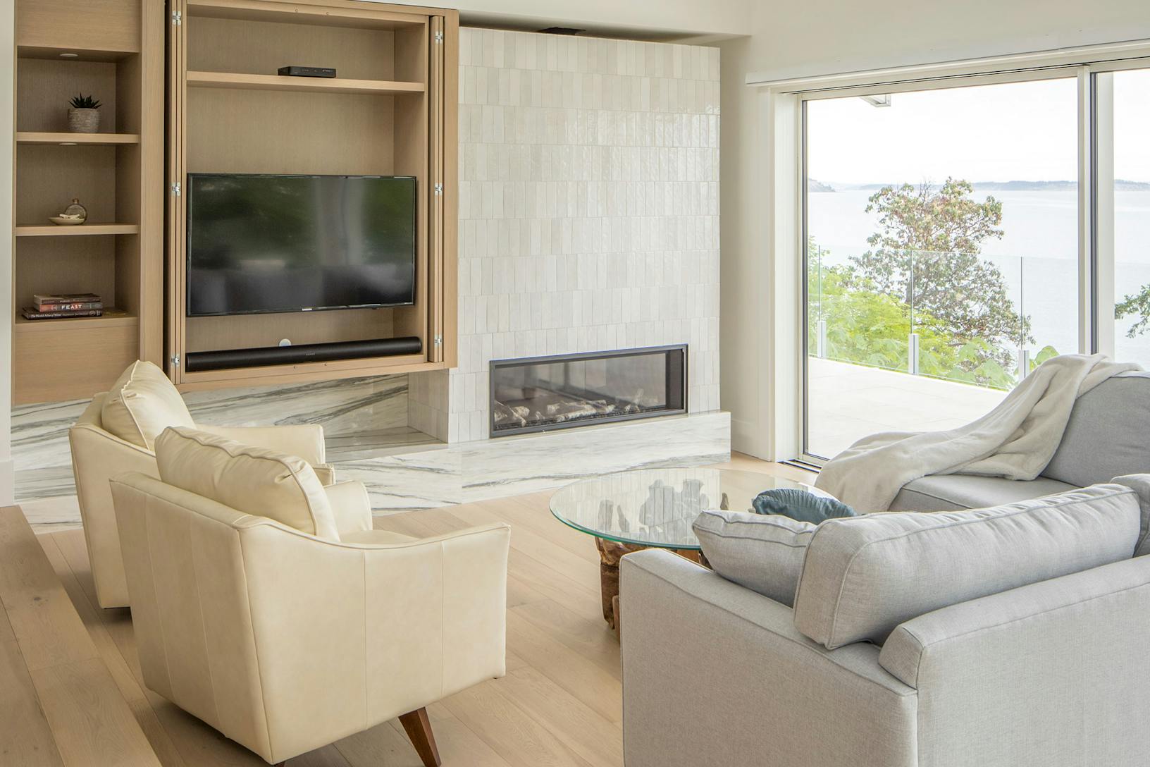 Modern living room featuring minimal glass walls