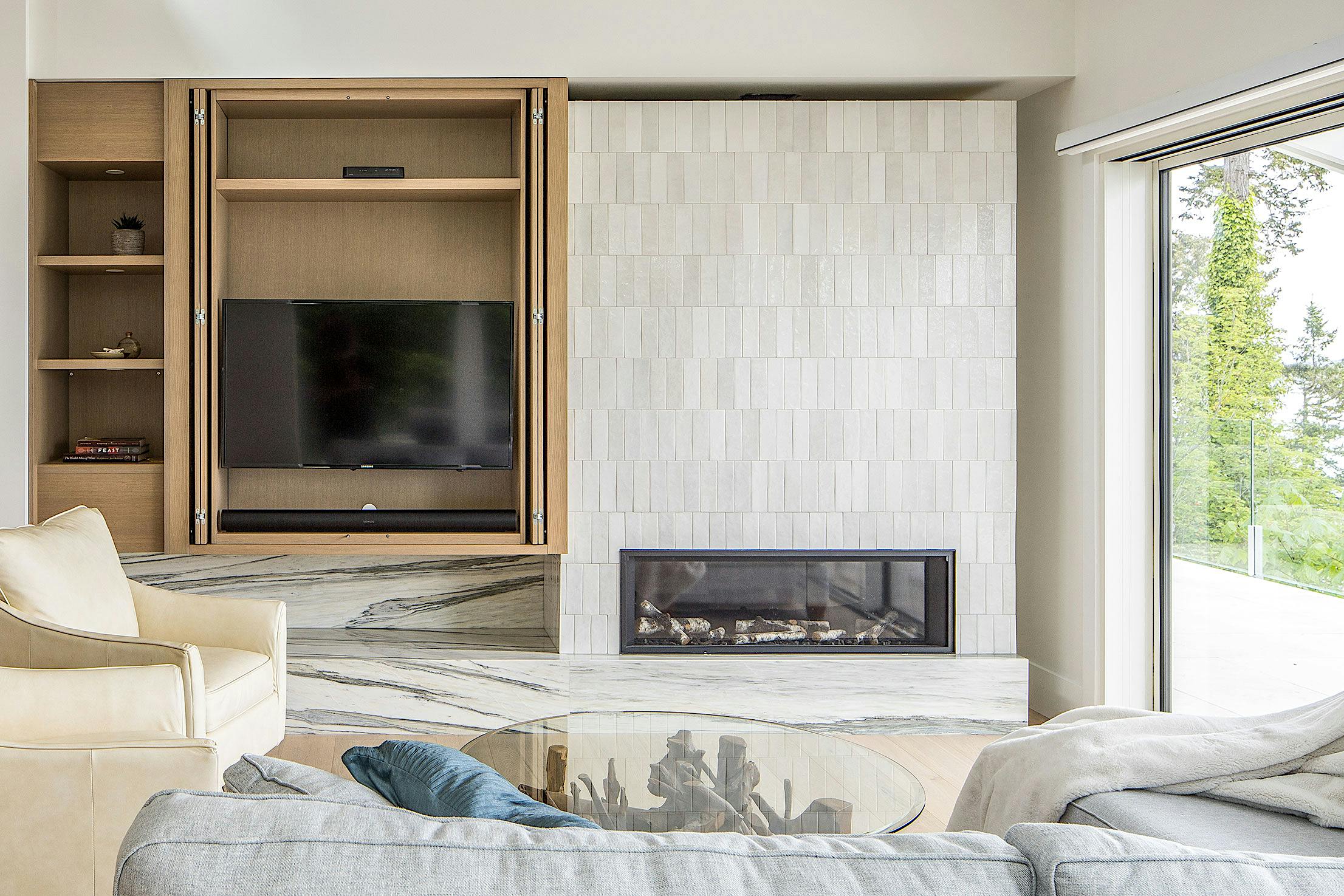 Modern living room with a fireplace and minimal sliding glass doors