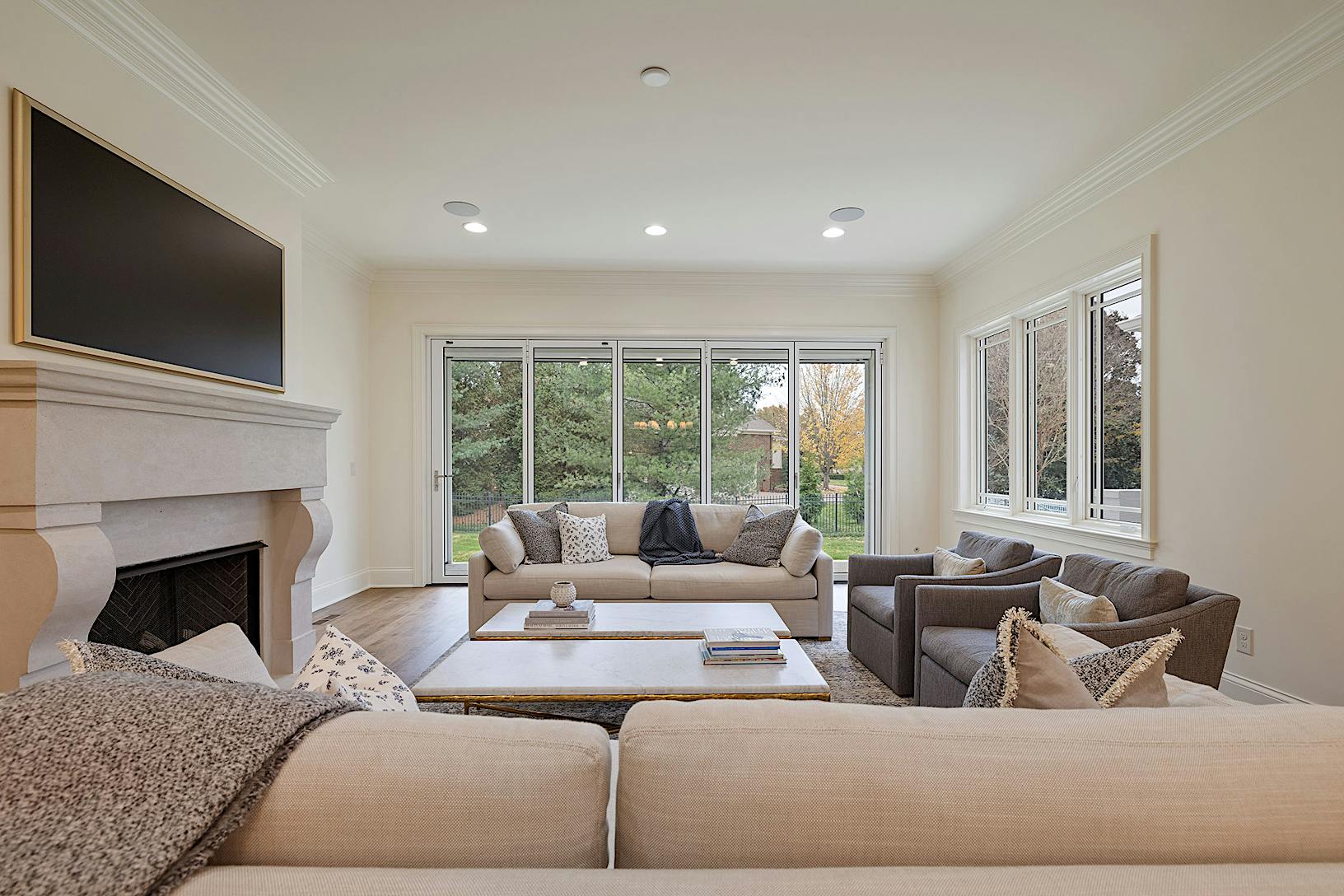 Modern living room featuring folding patio doors