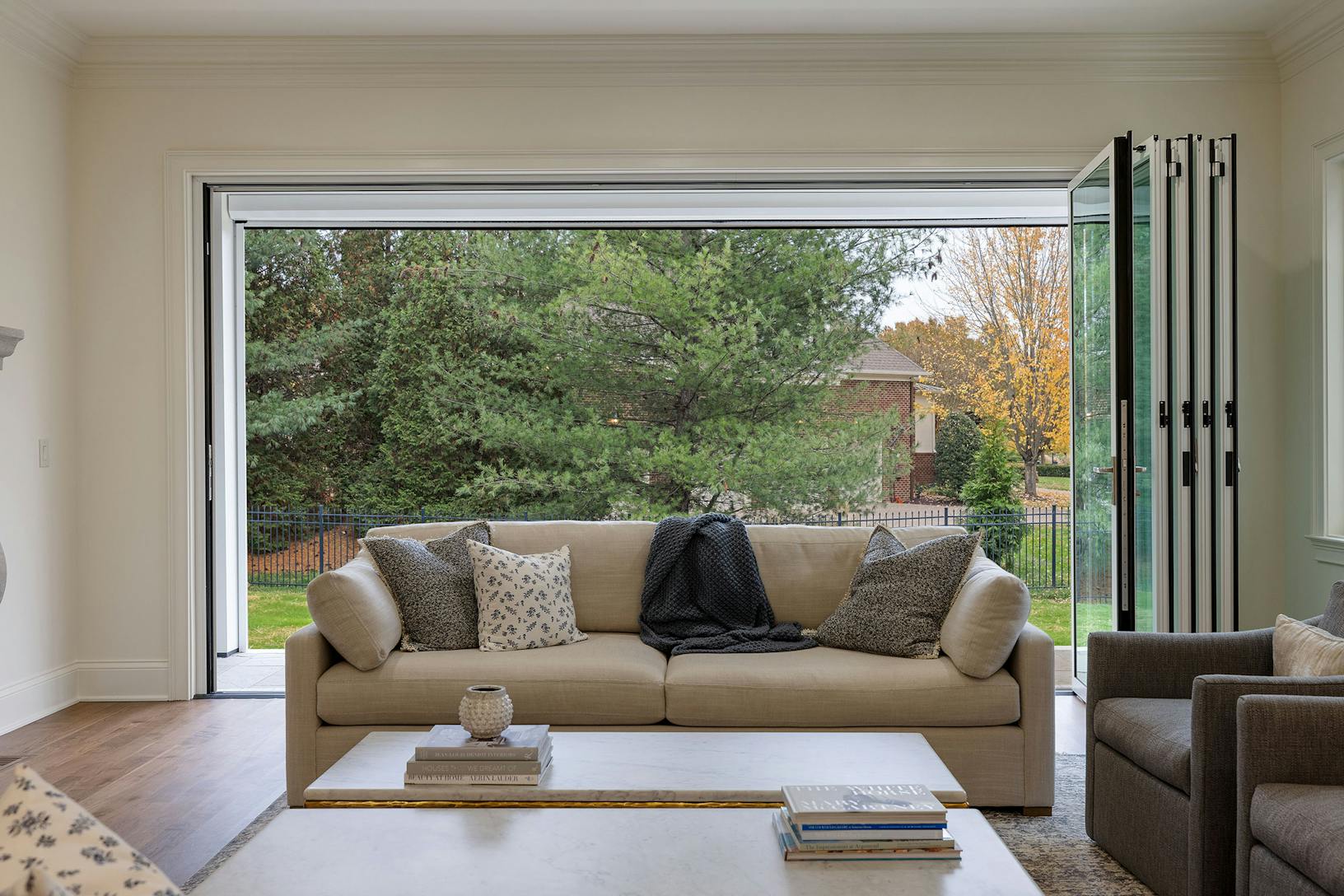 A living room with folding patio doors