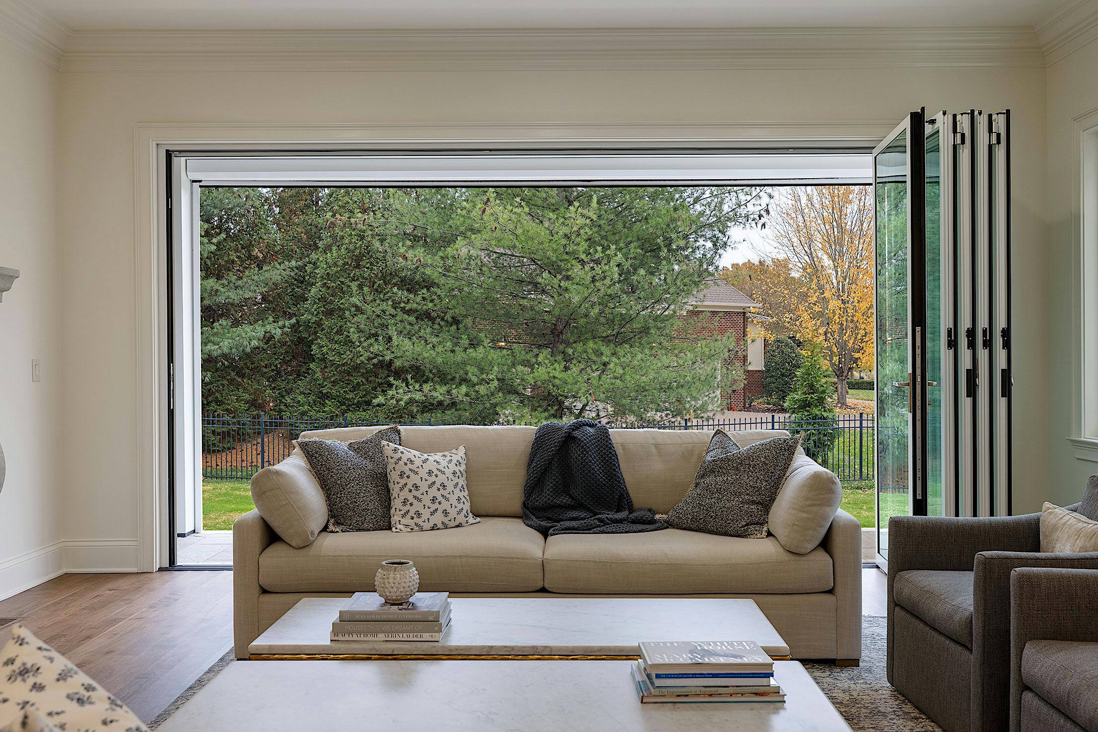 A living room with folding patio doors