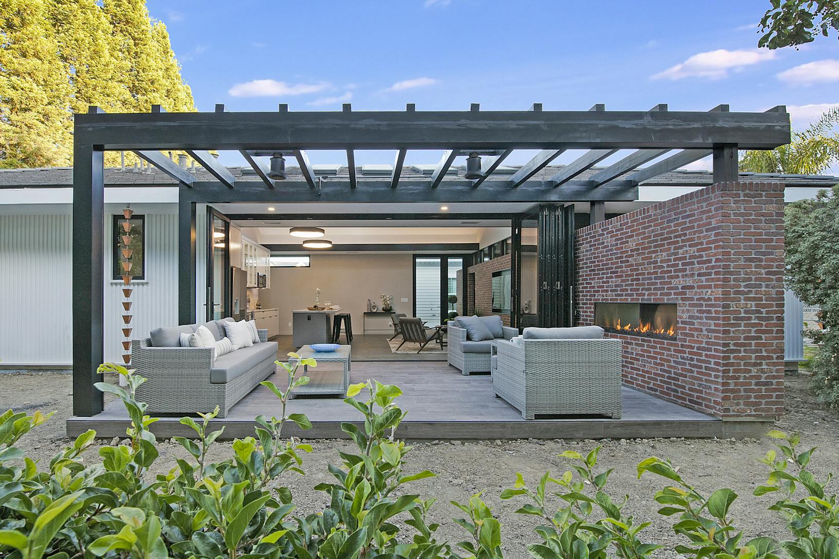 ADU outdoor living area with Aluminum Clad Folding Glass Walls