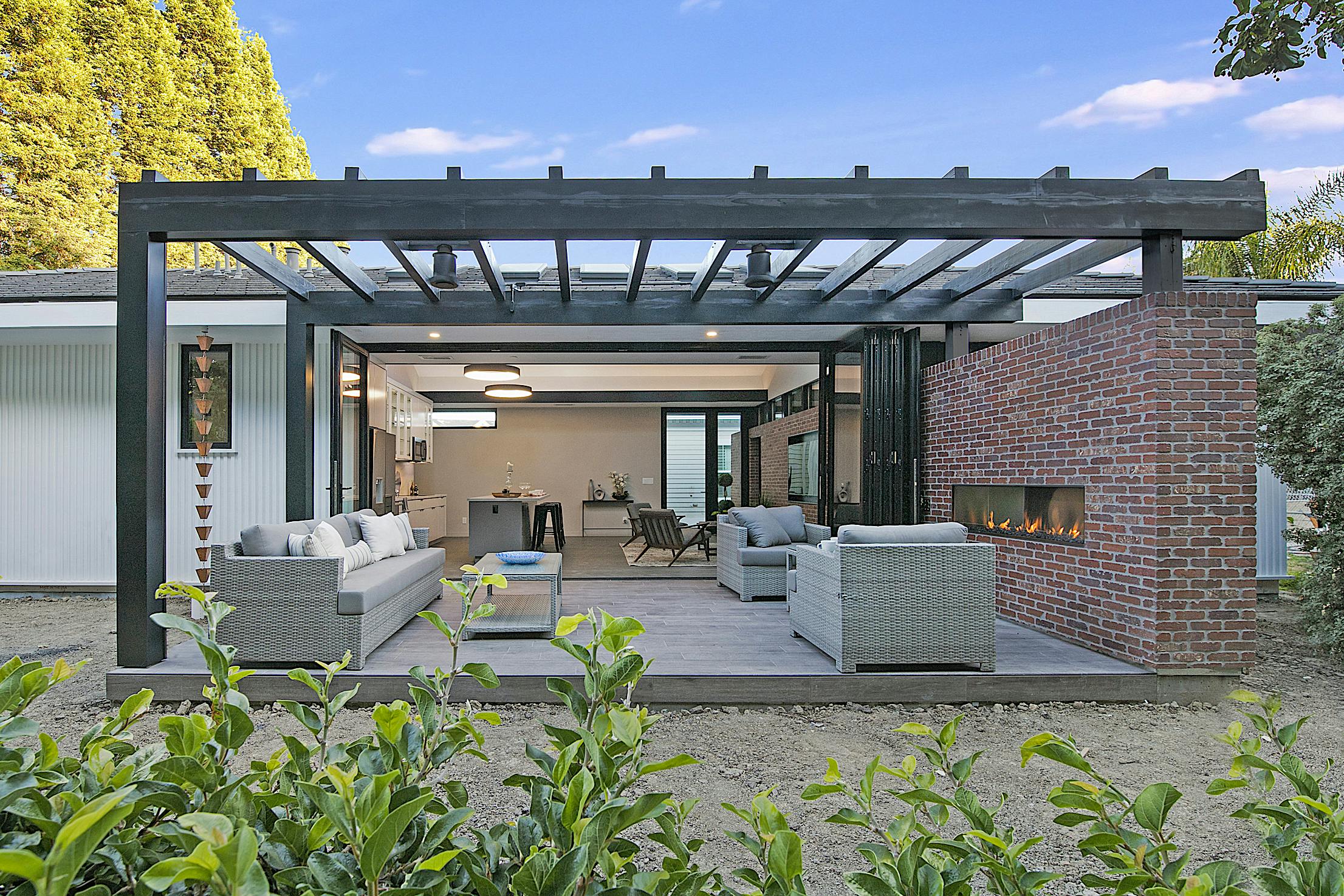 ADU outdoor living area with Aluminum Clad Folding Glass Walls