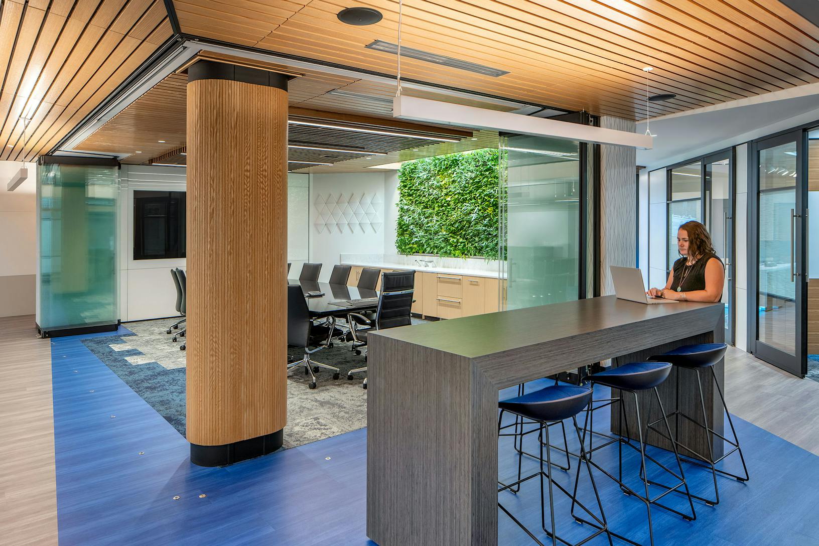 Modern office with opening frameless sliding glass walls