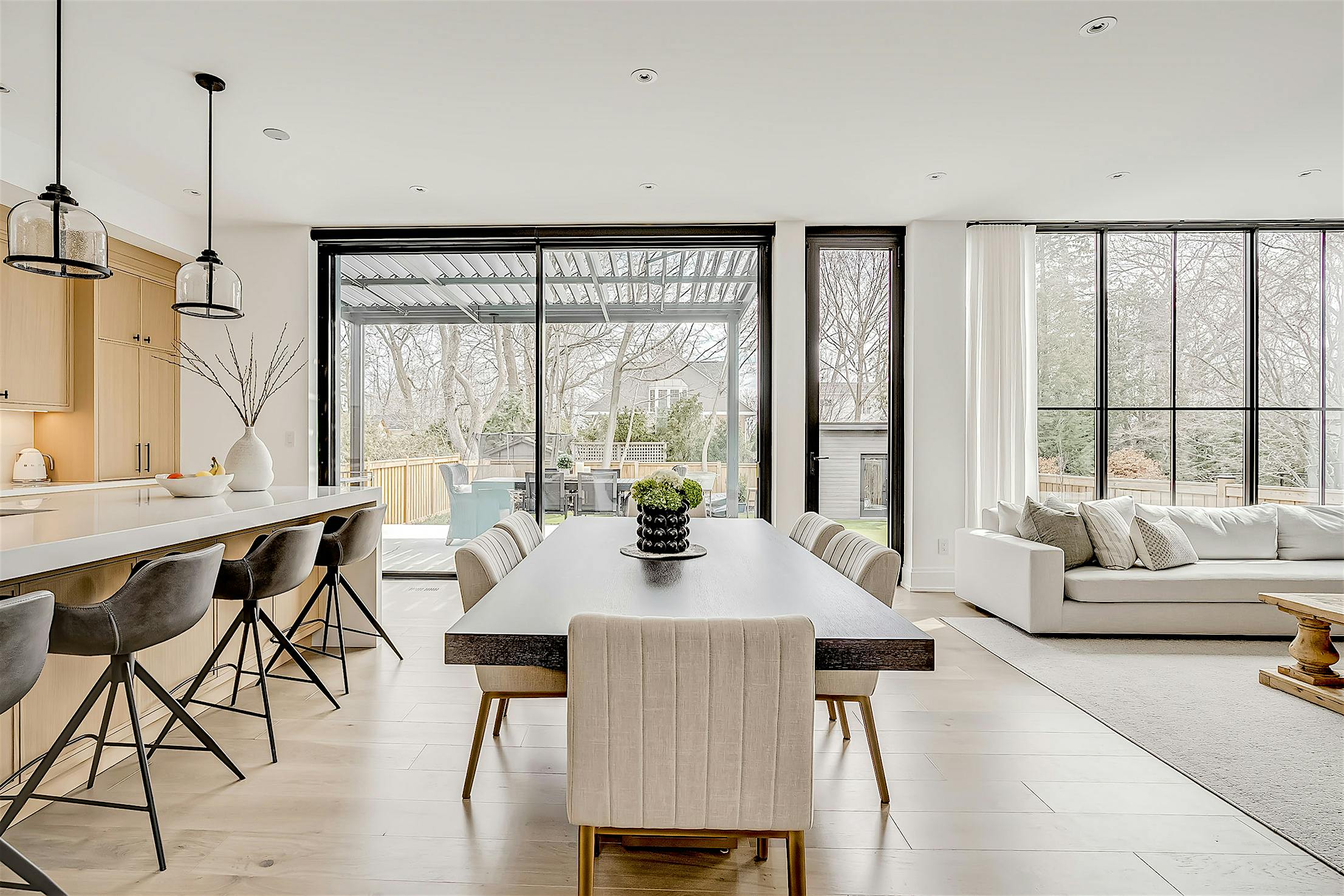 A modern kitchen and dining room with minimal sliding