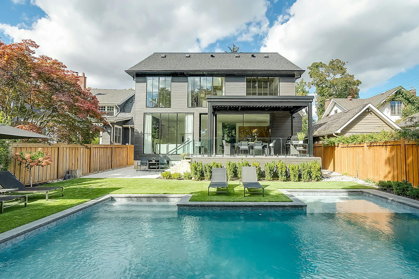 A modern home with a swimming pool in the backyard