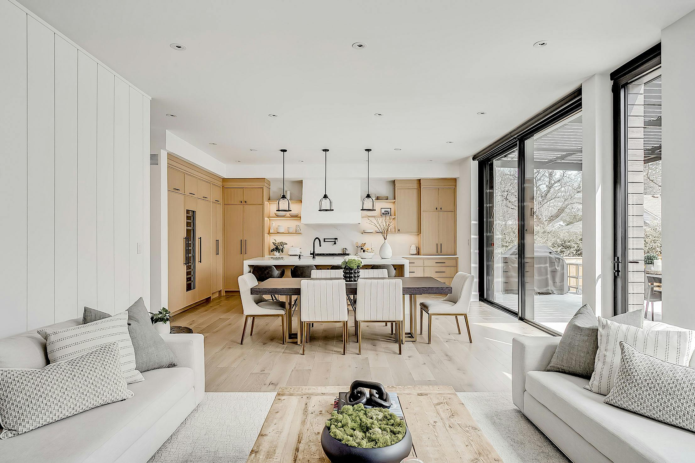 A modern living room with white walls and wooden floors