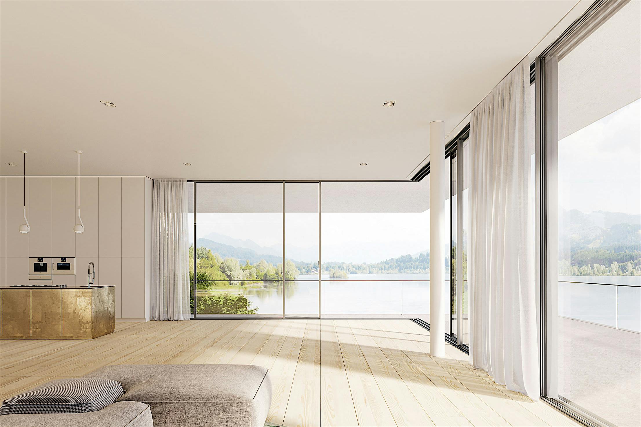 A living room with sliding patio doors offering a view of a lake