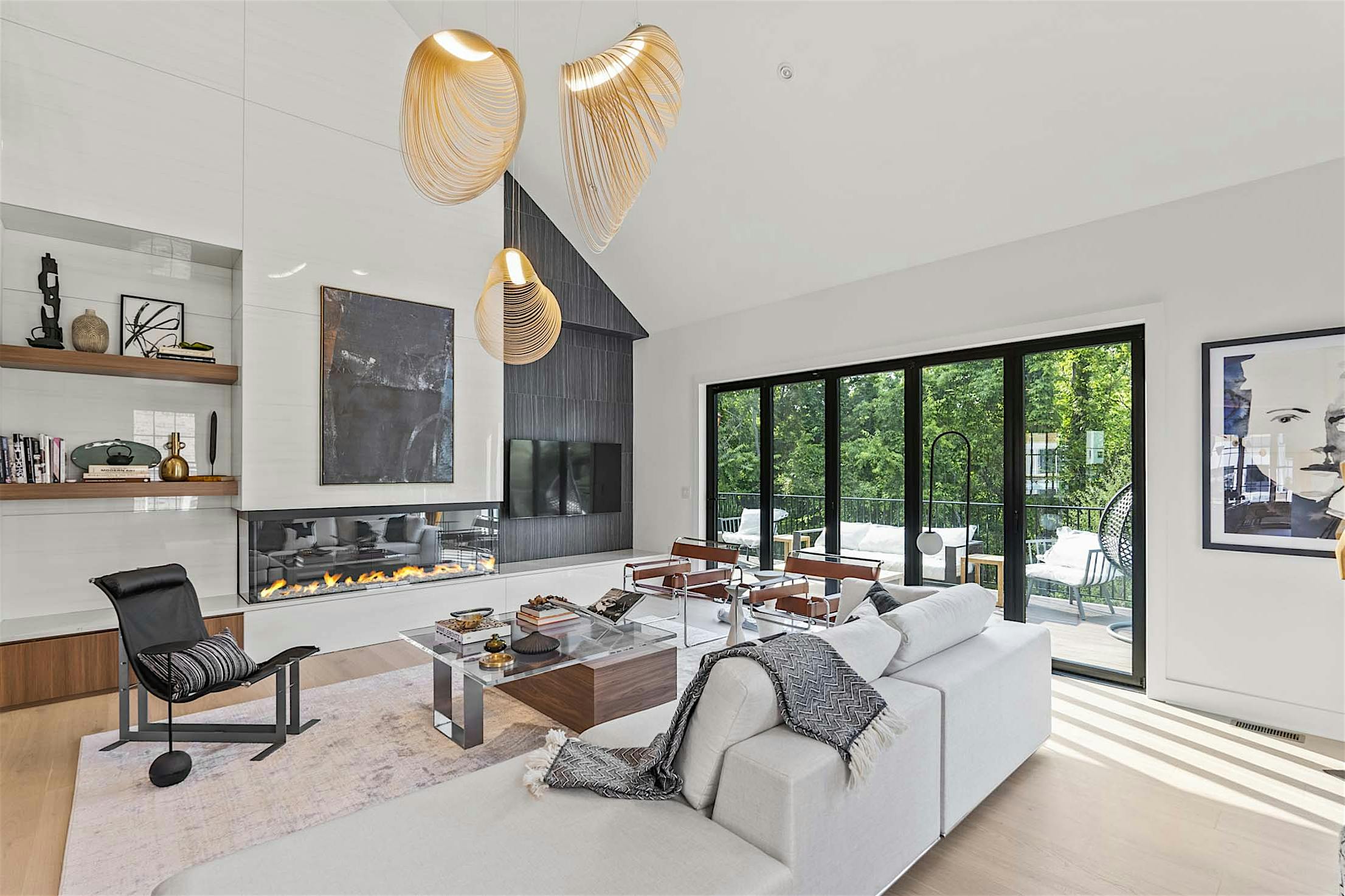 Accordion doors open to the patio, seamlessly blending indoor and outdoor spaces.