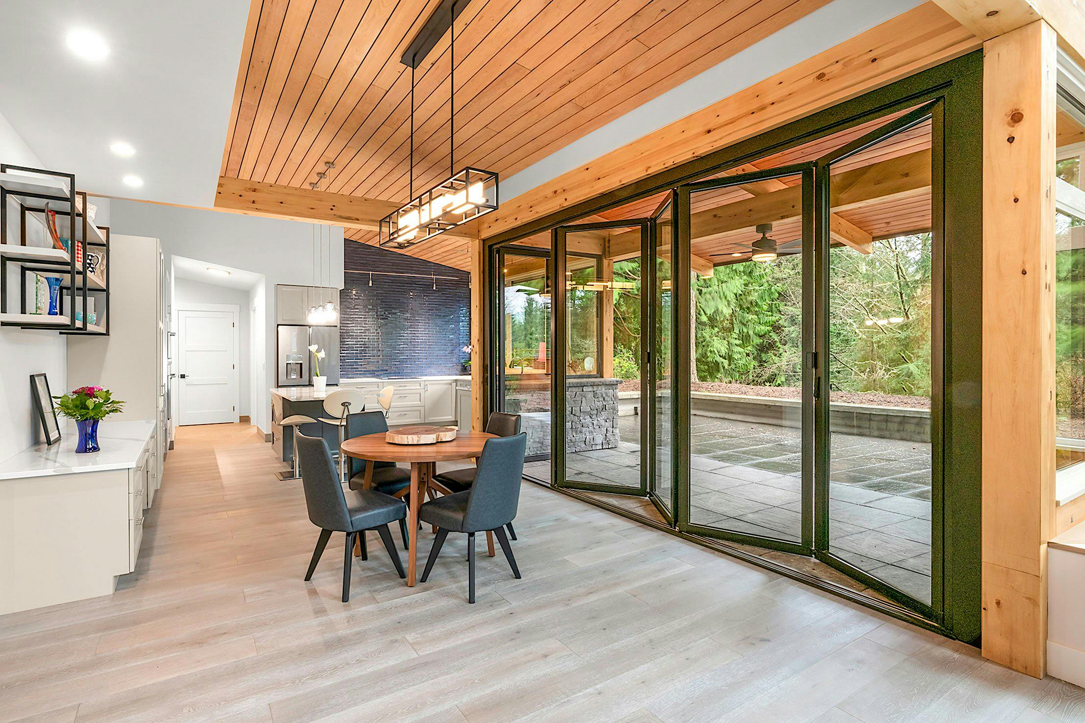 Retractable SL60 folding glass doors in Seattle, WA create a seamless indoor-outdoor connection for modern living