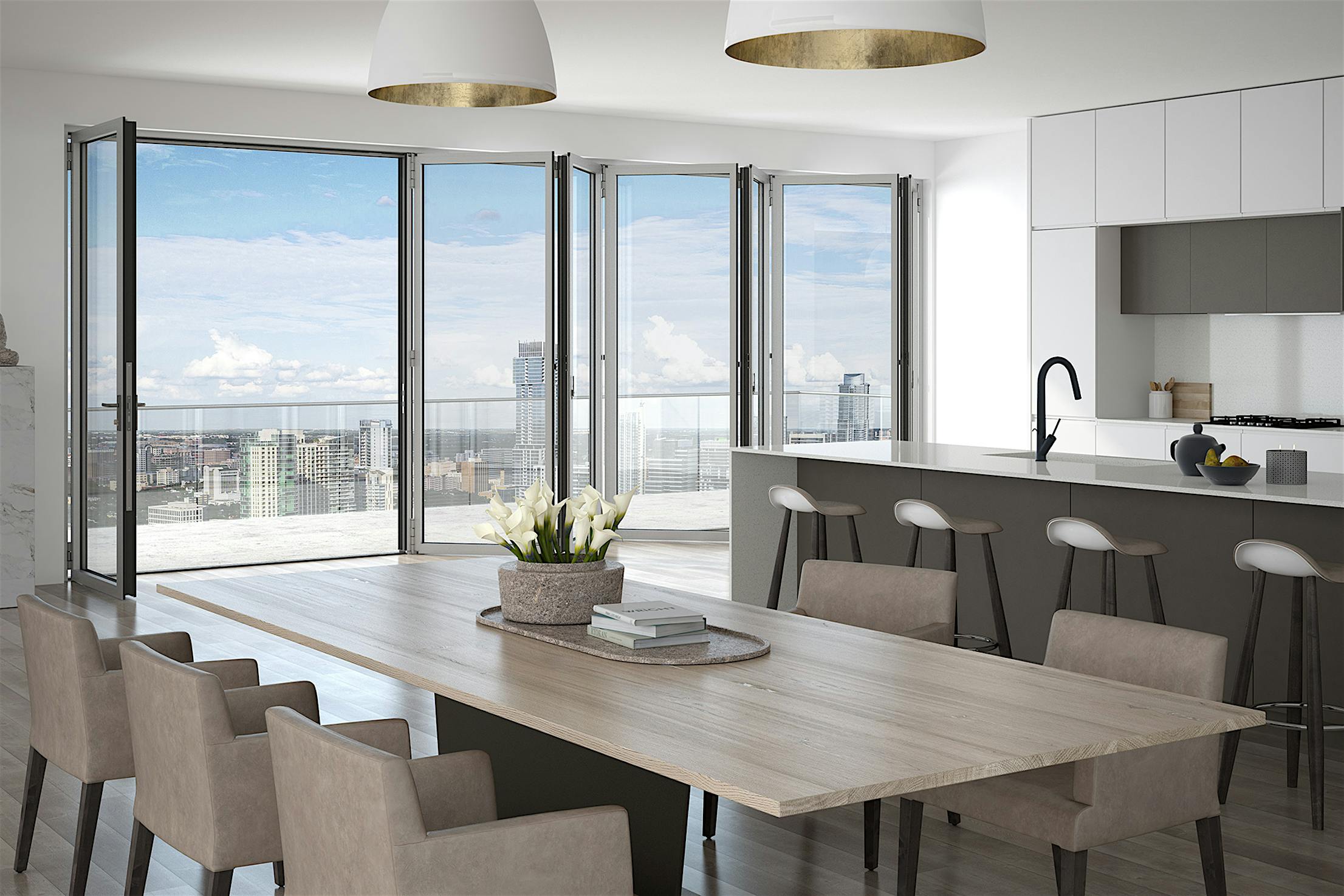 Mid and high-rise building with a view of the city through an aluminum framed folding glass wall