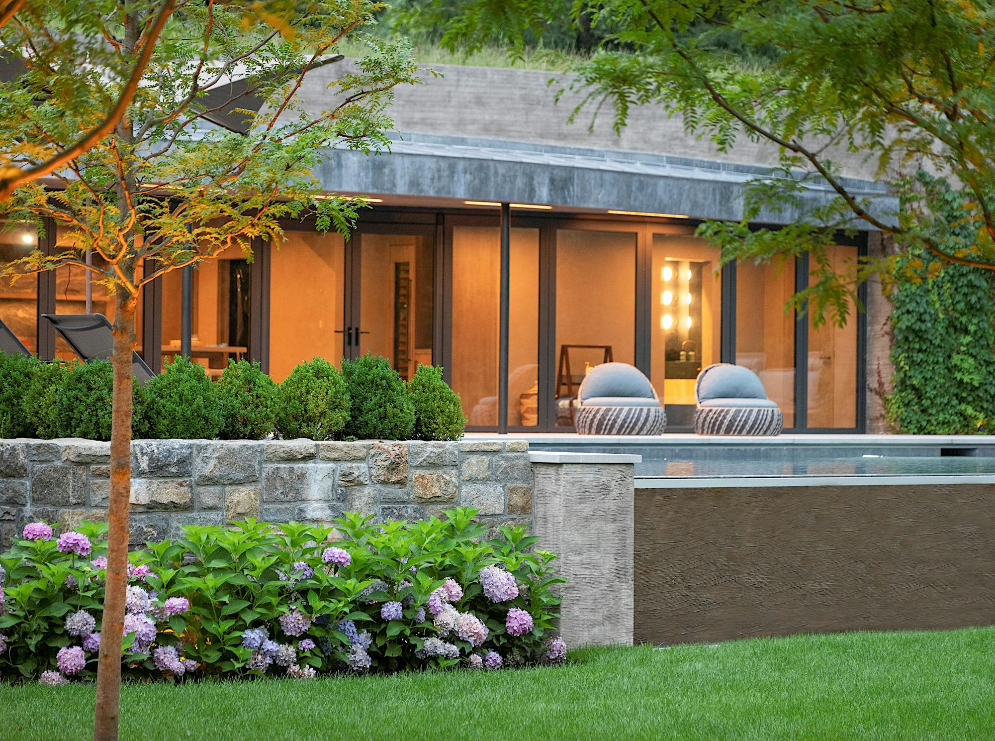 pool house design with NanaWall sliding glass doors