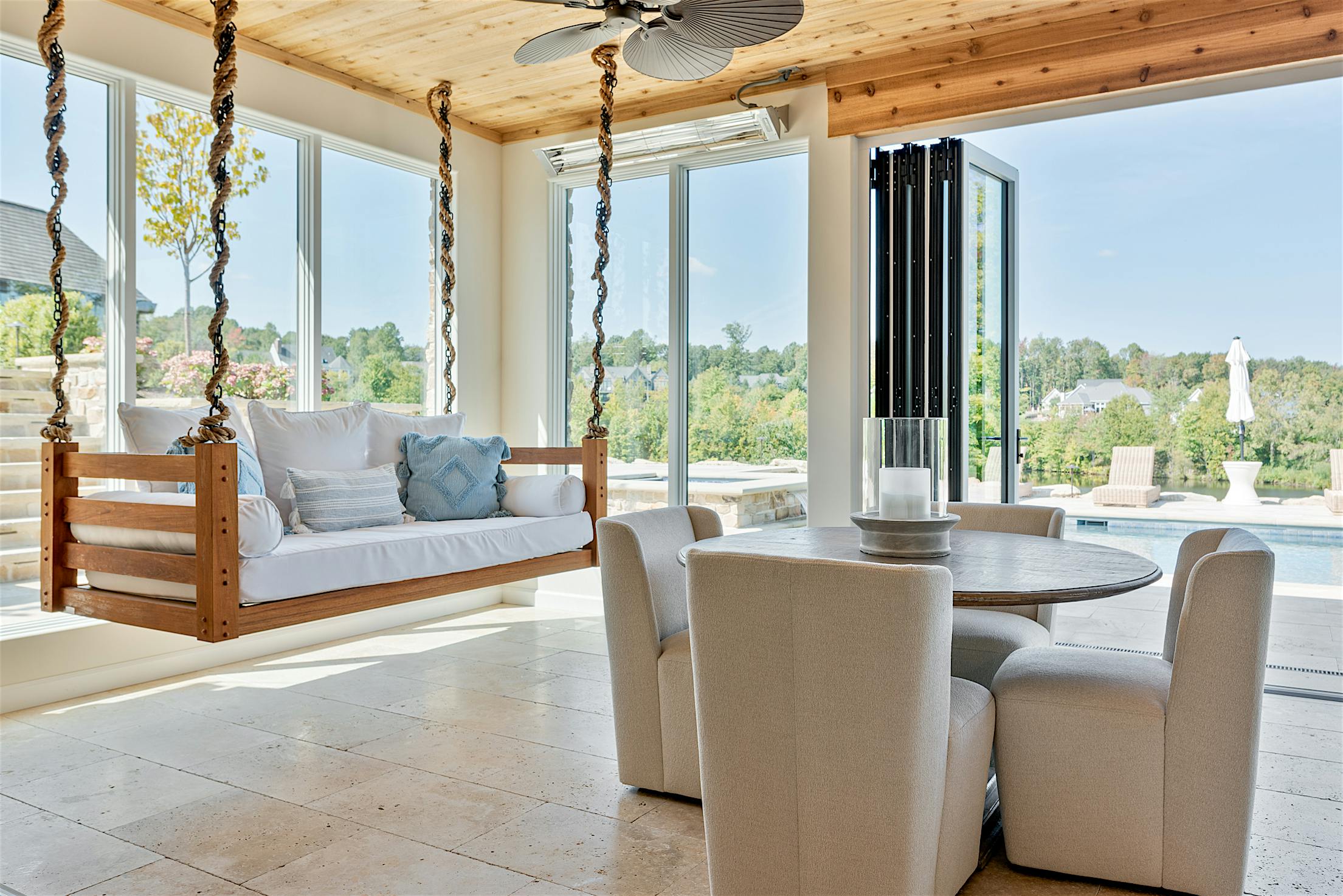 indoor-outdoor pool house design with clad bifold doors