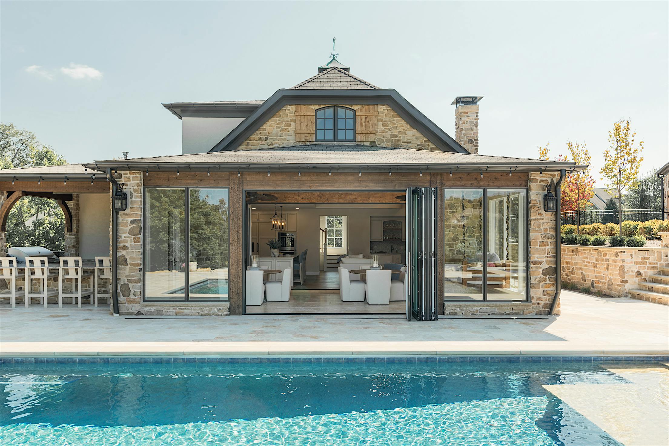 pool house with NanaWall aluminum clad bifold doors