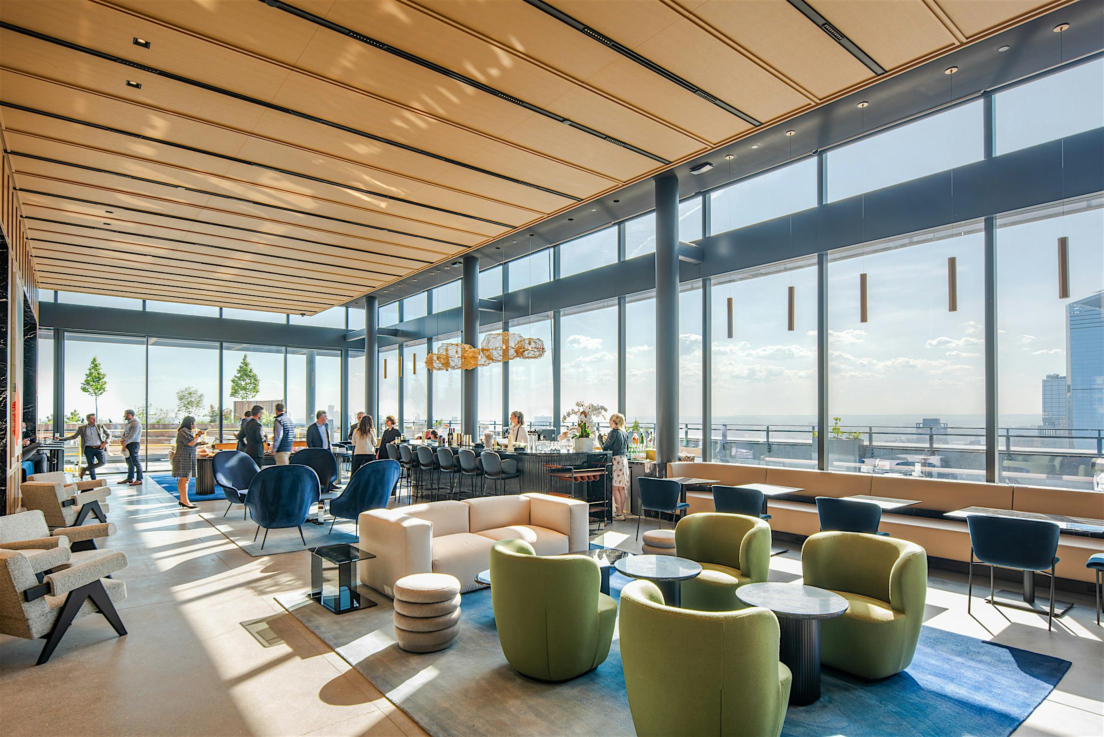 Opening glass doors with windload and impact ratings in modern lounge with city views.