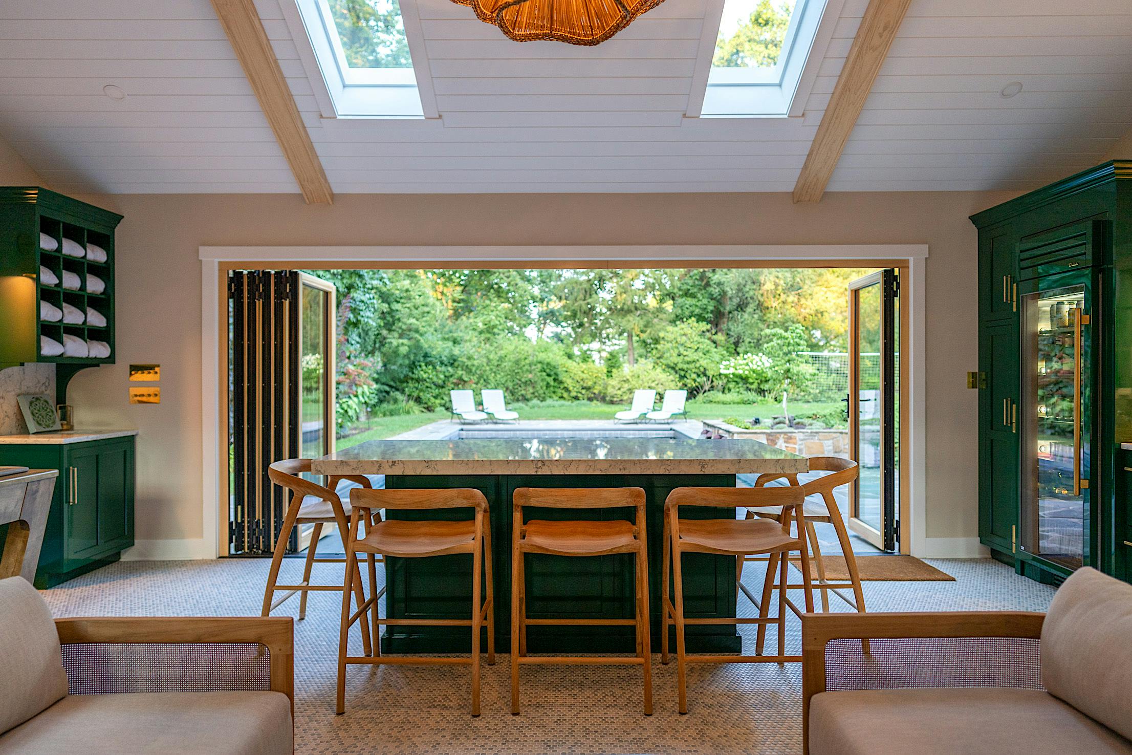contemporary pool house design with wood bifold doors
