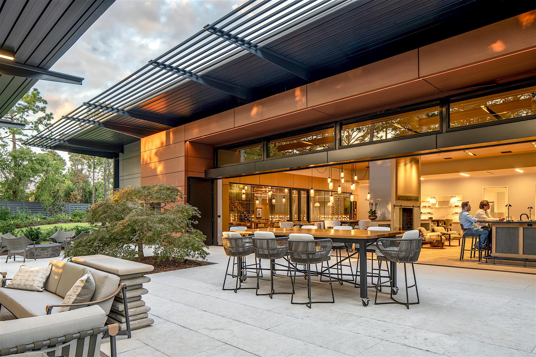 Goldenberg home in Wilmington NC showcasing NanaWall HSW60 top-hung sliding glass wall opening living space to exterior patio