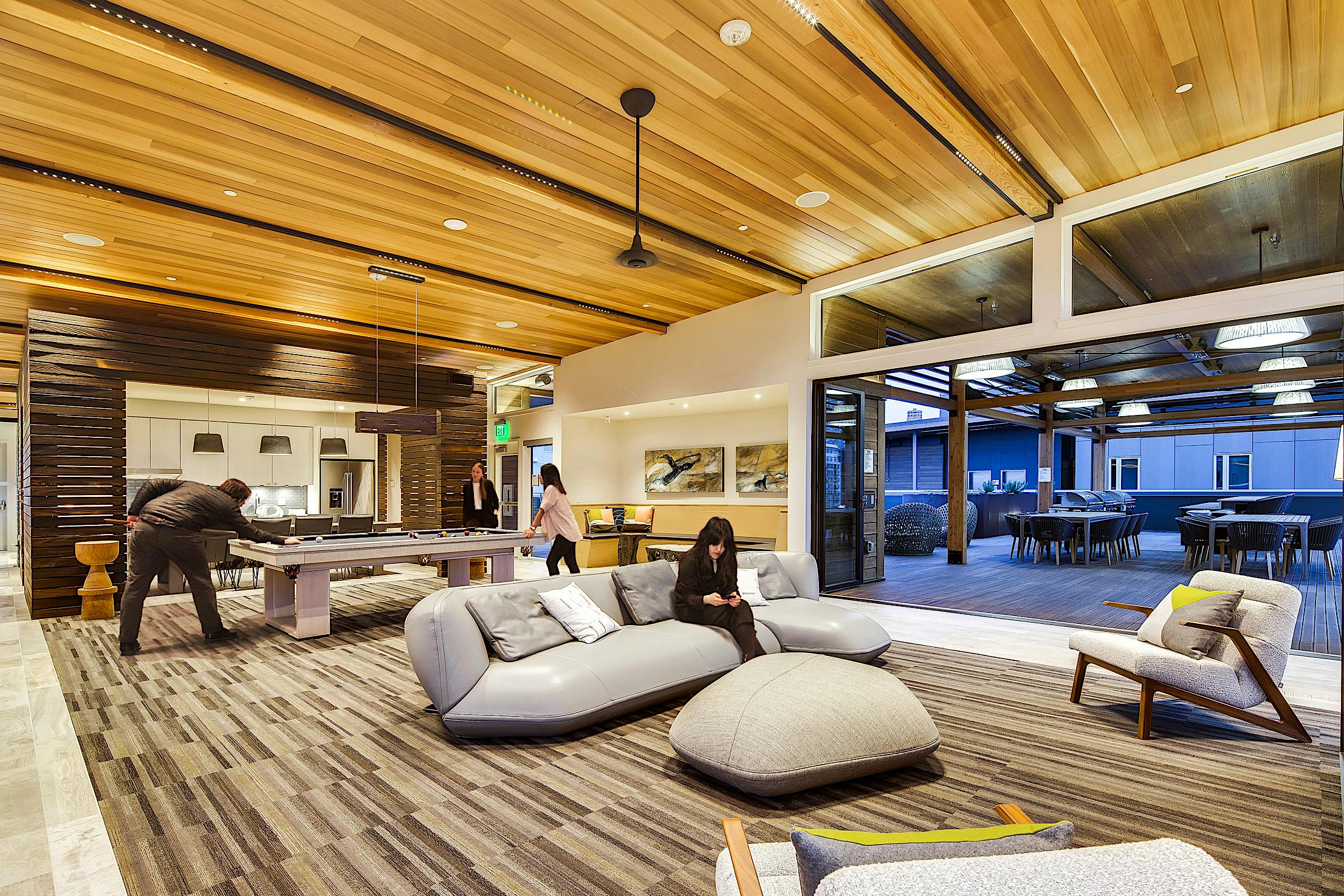 amenities in multifamily building design with bifold glass door