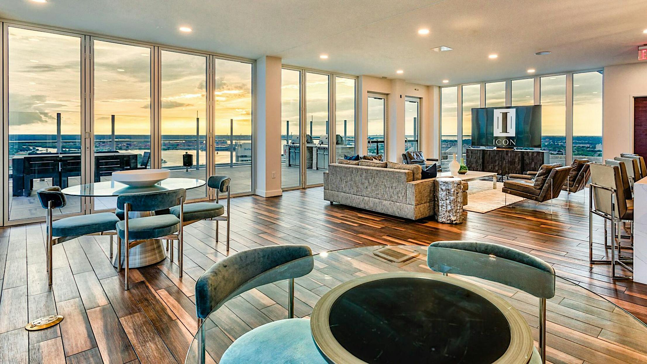 multifamily building design amenities space with bifold glass doors
