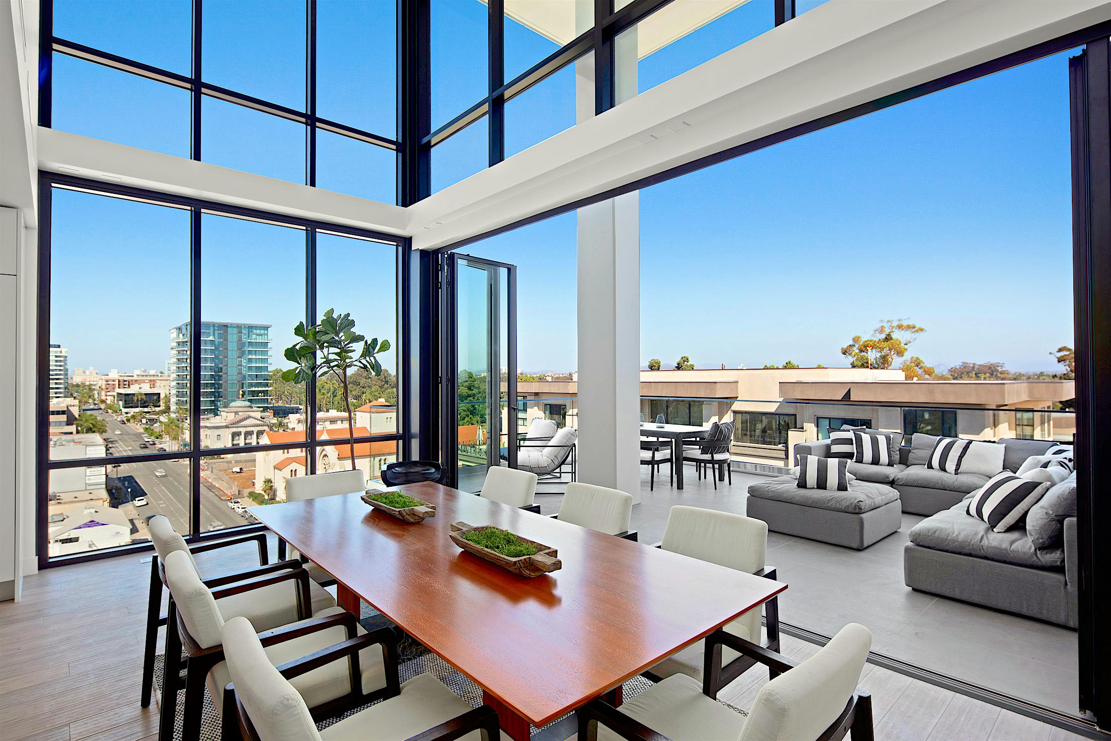 indoor-outdoor living on multifamily terrace with NanaWall bifold doors