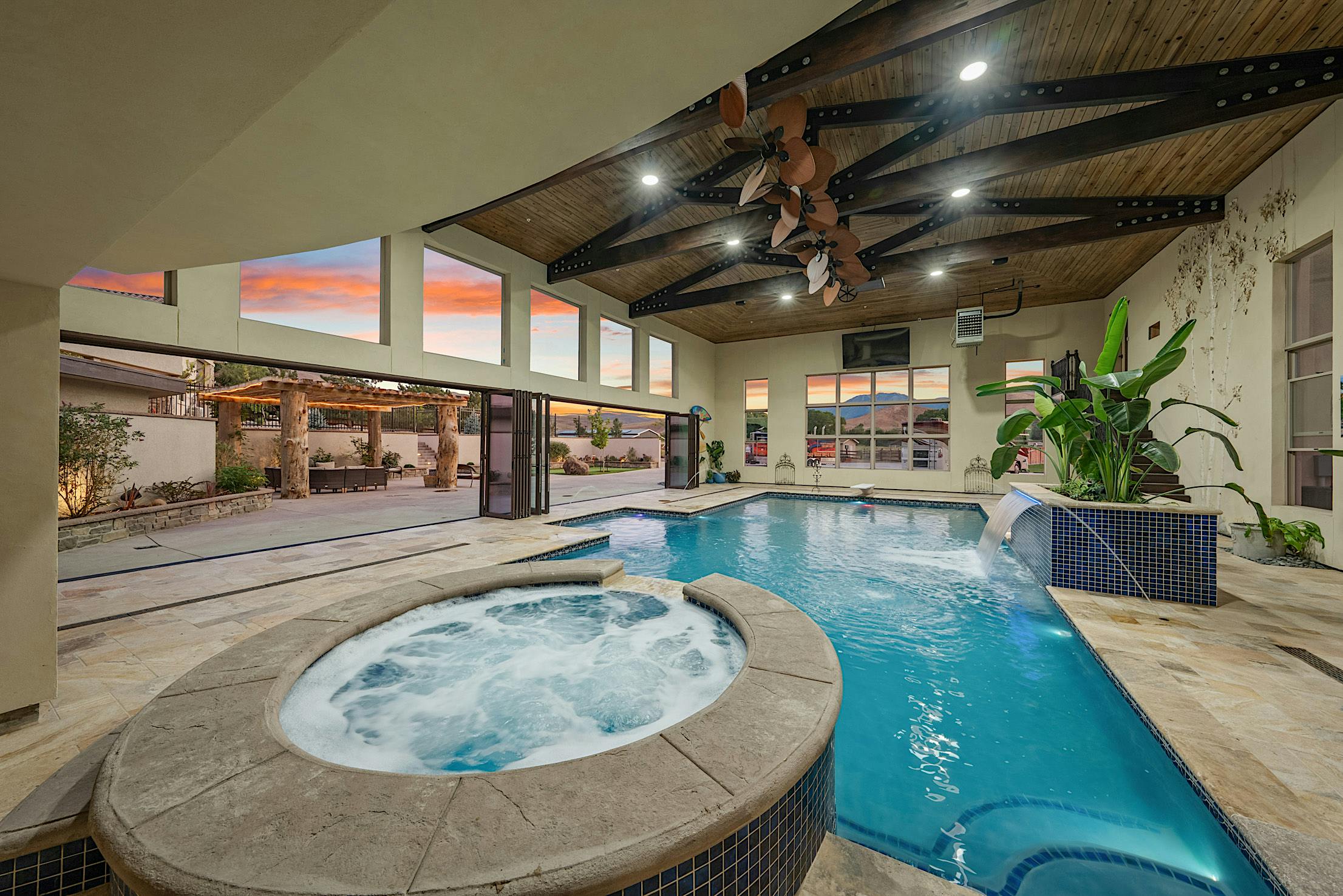 Pool-pavillion with movable glass doors