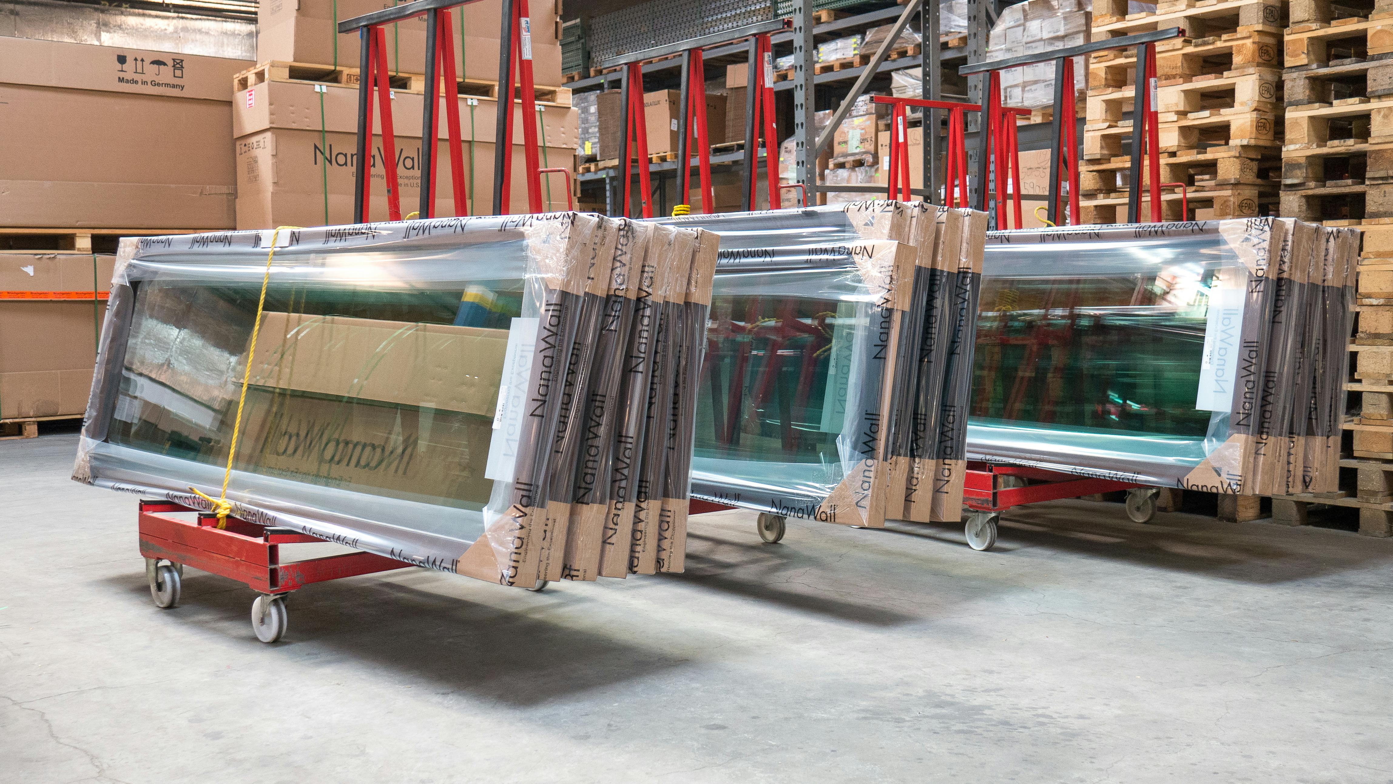 NanaWall glass panels staged for assembly and quality inspection at the Richmond manufacturing facility