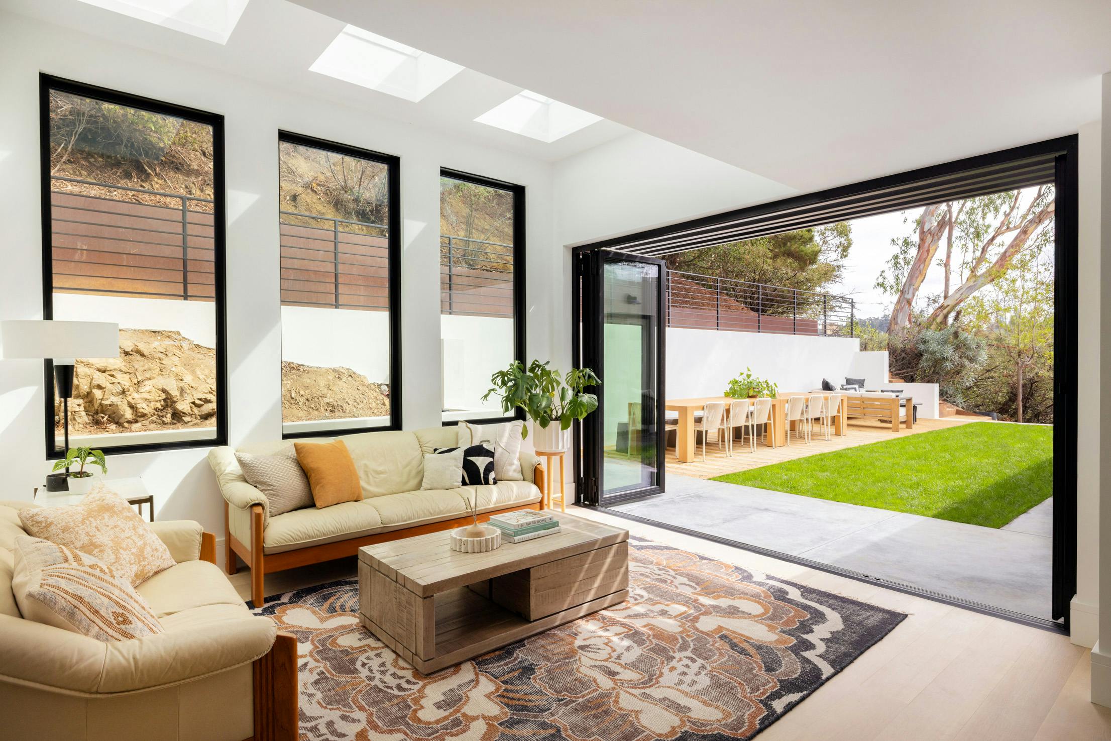 retractable glass wall in modern home remodel